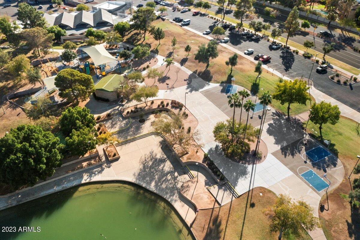 2524 South El Paradiso, Unit 50 Mesa, AZ 85202 - Photo 32 of 36 an aerial view of a house with a yard and swimming pool