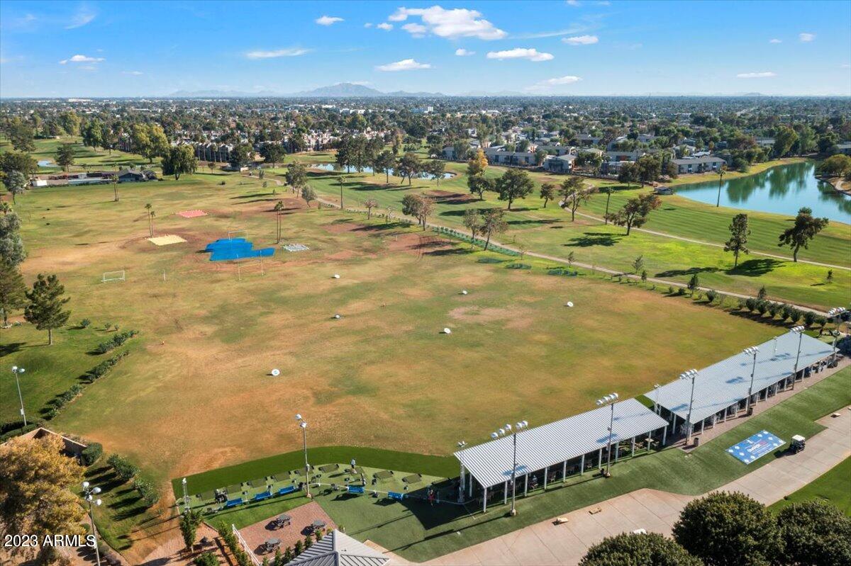 2524 South El Paradiso, Unit 50 Mesa, AZ 85202 - Photo 33 of 36 an aerial view of residential houses with outdoor space