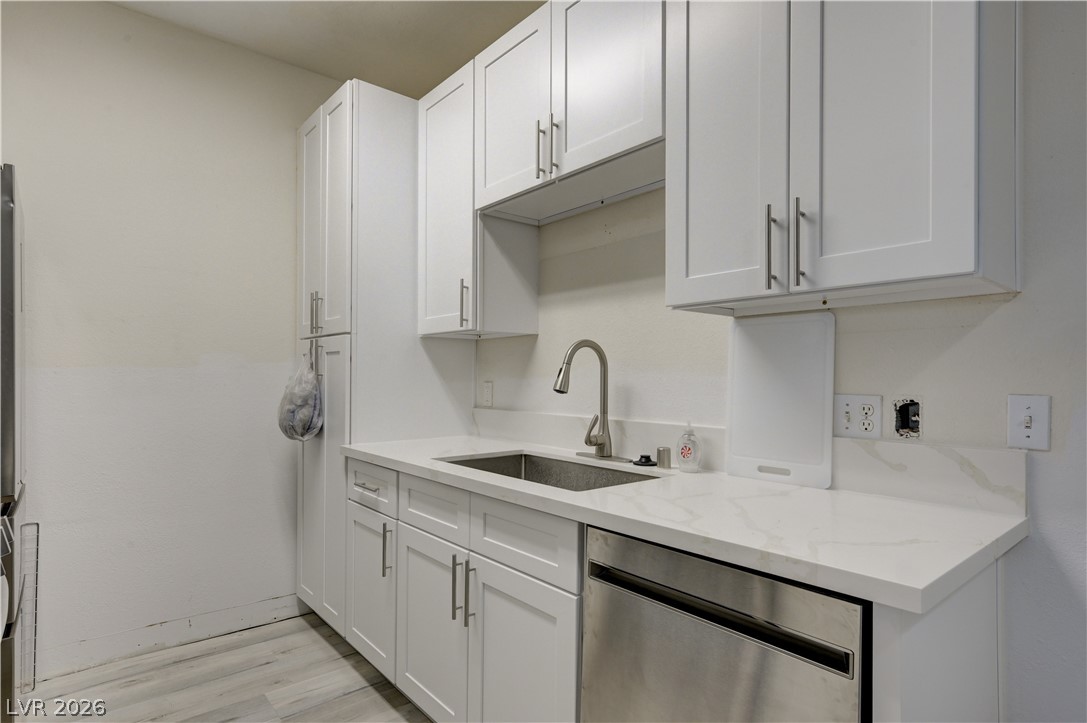 4730 East Craig Road, Unit 1155 Las Vegas, NV 89115 - Photo 13 of 41 Modern cabinetry and pristine countertops complement this utility space, providing both style and functionality.