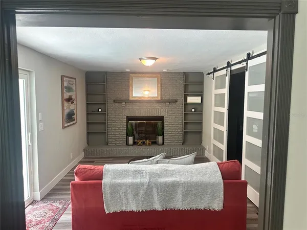 a bedroom with a bed and a fireplace