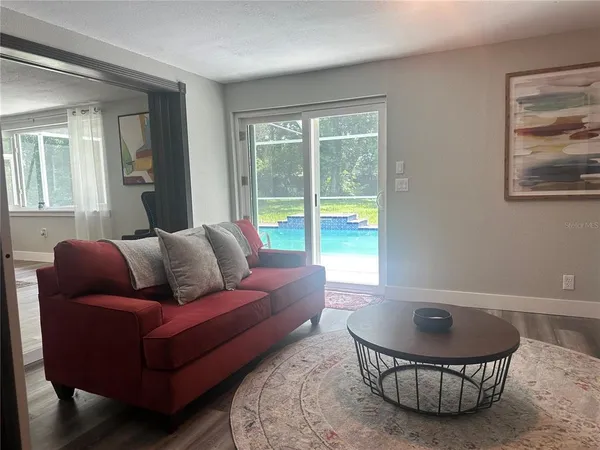 a living room with furniture and a large window