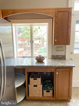 a kitchen with a refrigerator and a sink