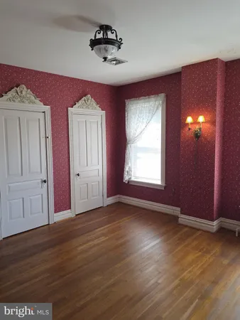 a view of empty room with windows