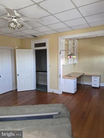a view of a backyard with wooden fence