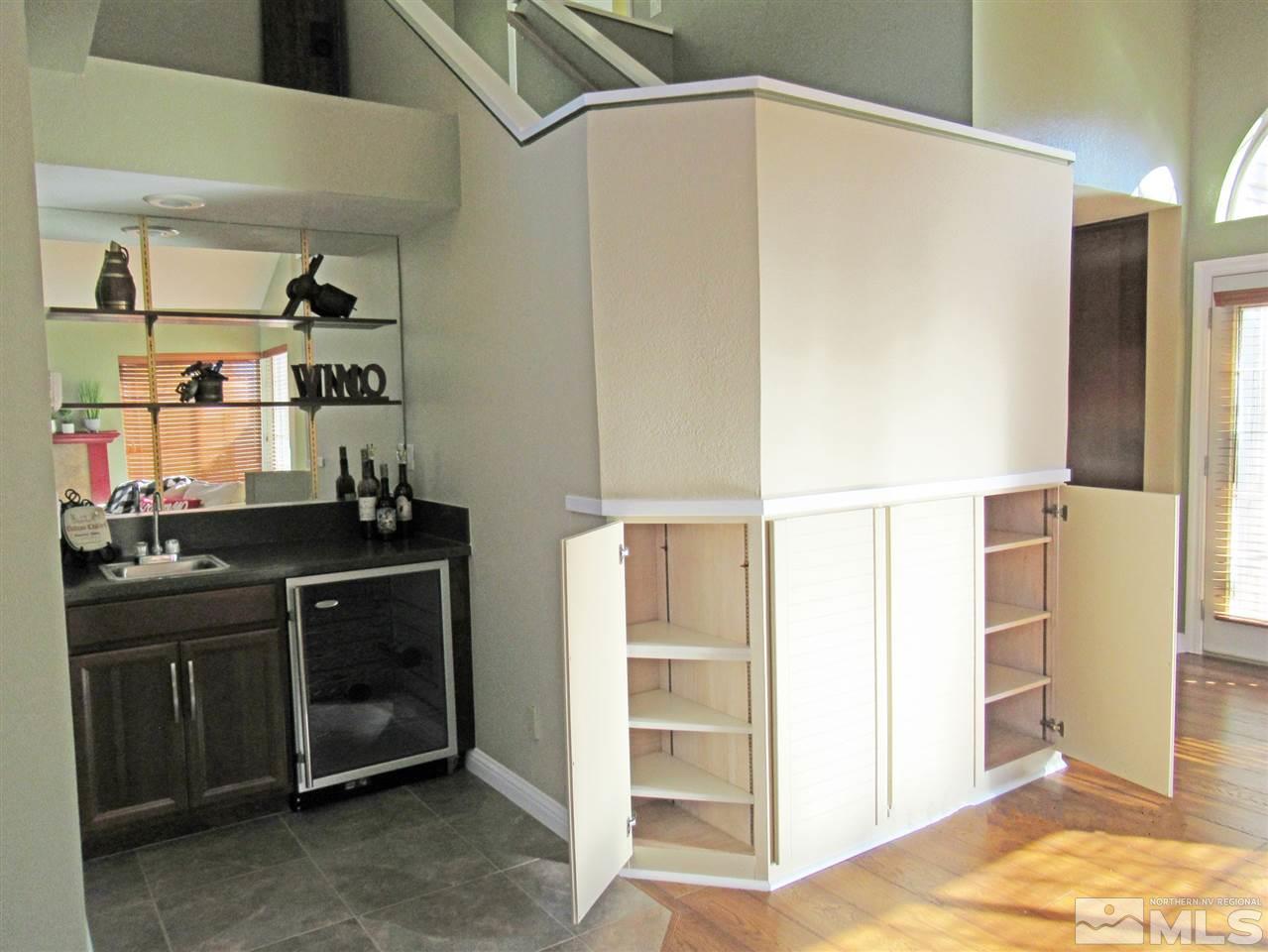 2509 Starr Meadows Loop Reno, NV 89519 - Photo 4 of 18 a kitchen with stainless steel appliances kitchen island granite countertop a refrigerator and a stove