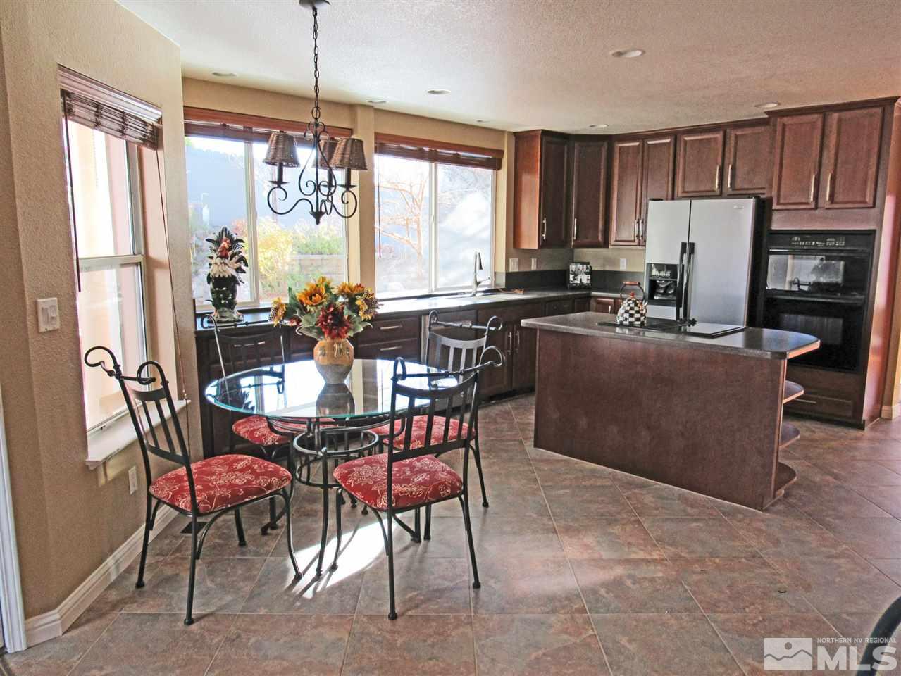 2509 Starr Meadows Loop Reno, NV 89519 - Photo 7 of 18 a view of a dining room with furniture window and outside view