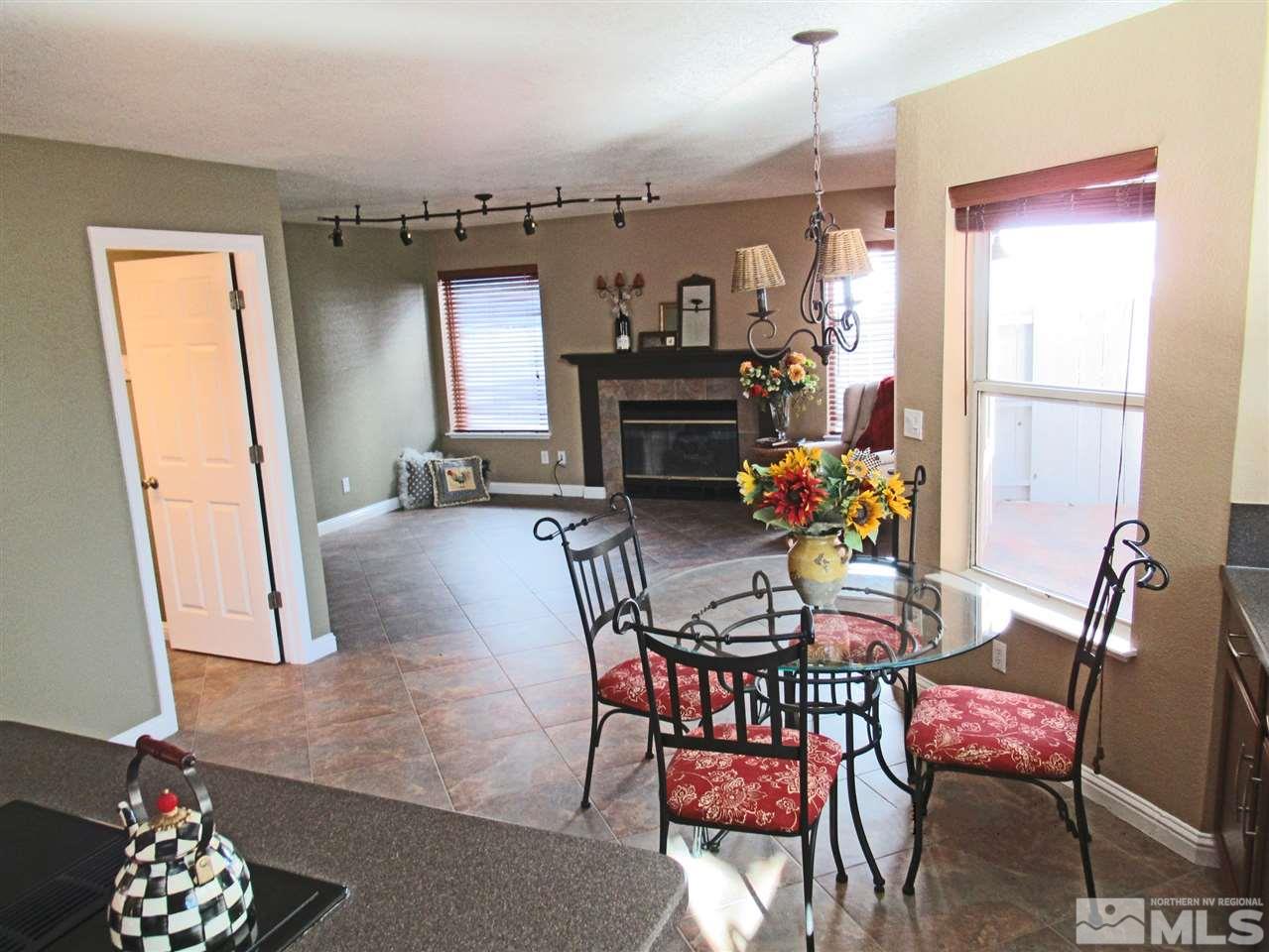2509 Starr Meadows Loop Reno, NV 89519 - Photo 8 of 18 a view of a dining room with furniture and a chandelier