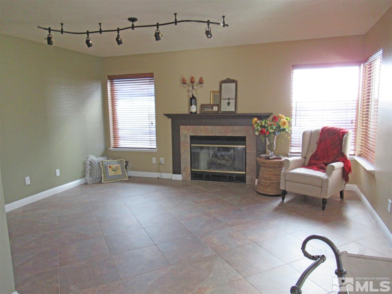 2509 Starr Meadows Loop Reno, NV 89519 - Photo 9 of 18 a living room with furniture and a fireplace