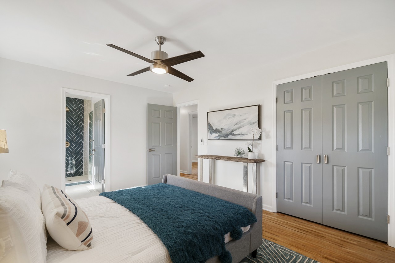 209 Stable Road Franklin, TN 37069 - Photo 17 of 25 a bedroom with a bed a dresser and wooden floor