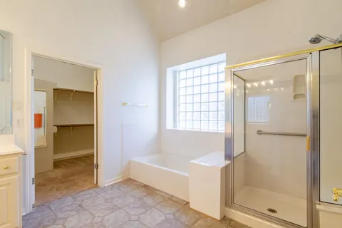 a bathroom with a bathtub and a shower