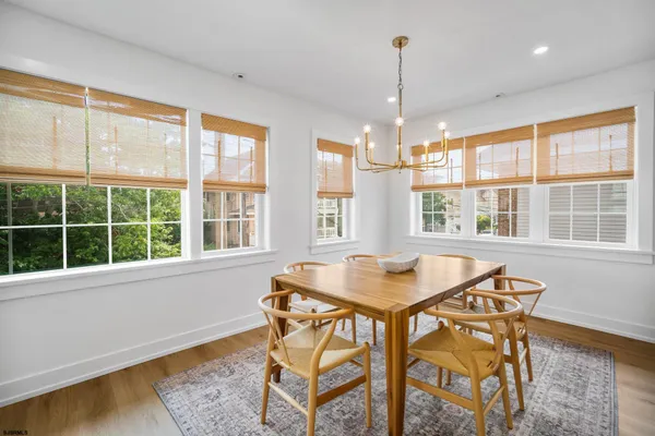 a dining room with a table and chairs