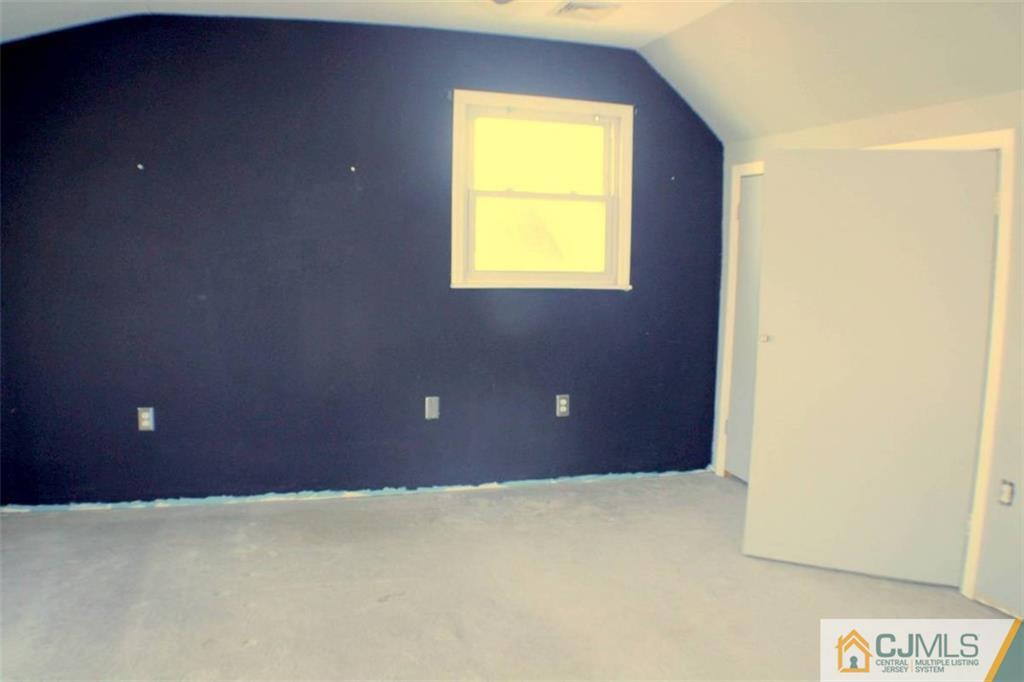 17 Rodney Road East Brunswick, NJ 08816 - Photo 11 of 16 a view of an empty room with a window