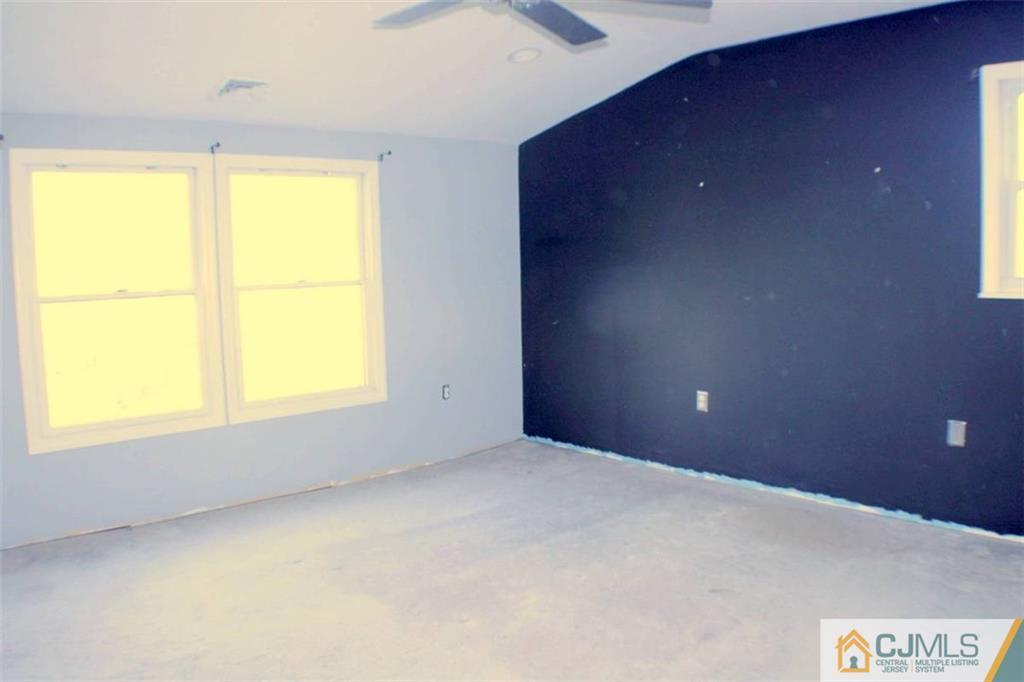 17 Rodney Road East Brunswick, NJ 08816 - Photo 12 of 16 an empty room with a window
