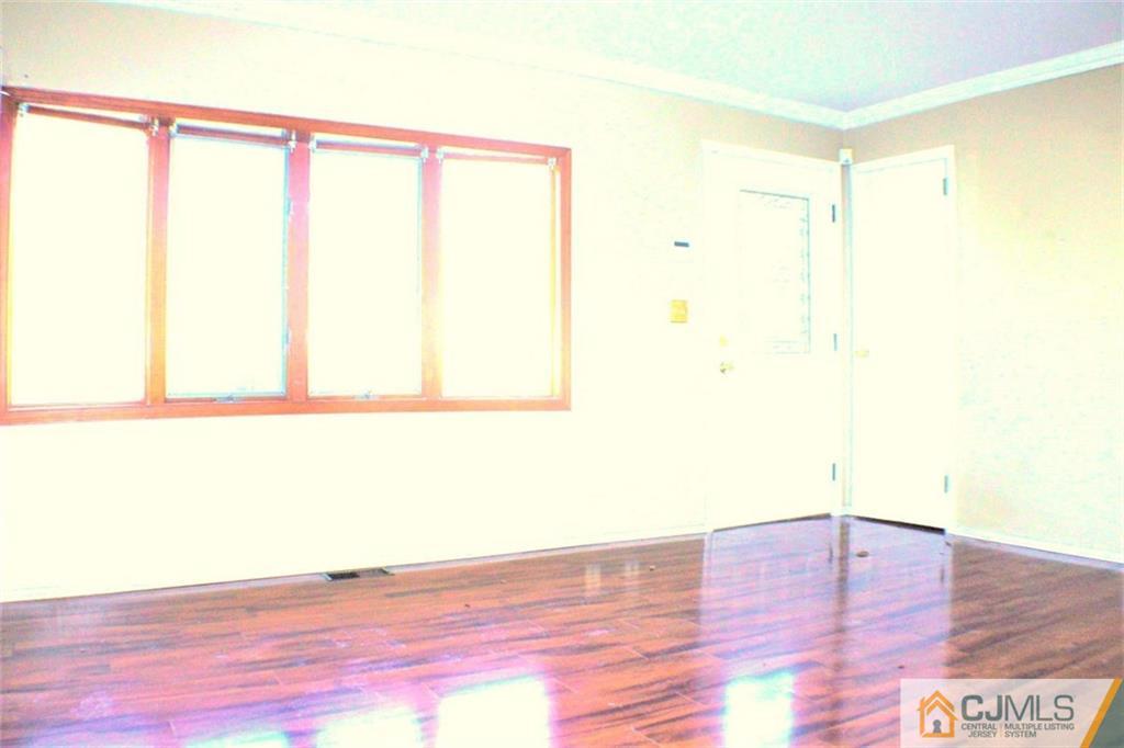 17 Rodney Road East Brunswick, NJ 08816 - Photo 3 of 16 a view of a room with wooden floor