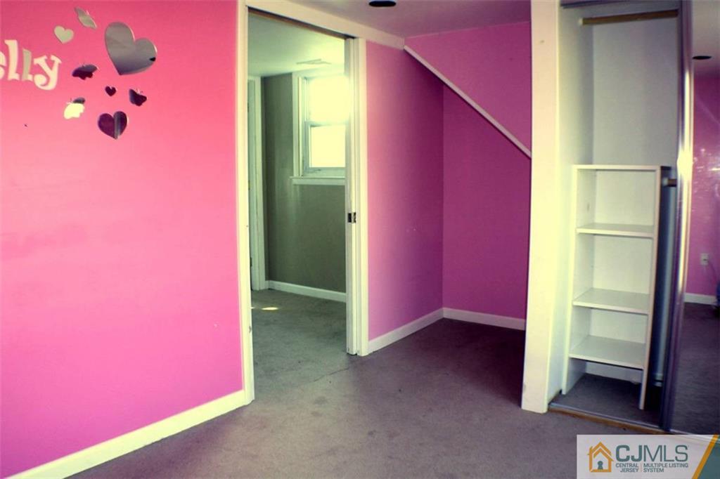 17 Rodney Road East Brunswick, NJ 08816 - Photo 10 of 16 a view of an empty room with a window