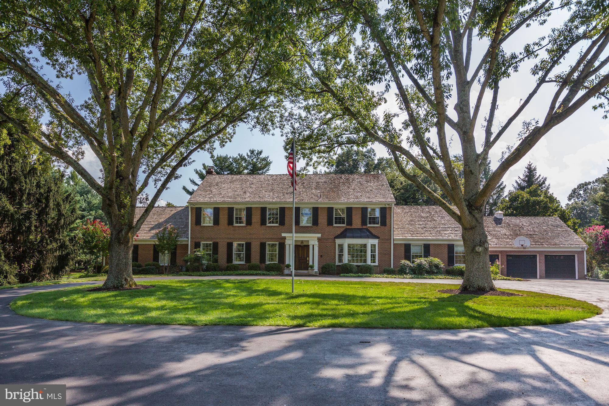 11000 Cripplegate Road Potomac, MD 20854 - Photo 1 of 44 a front view of a house with a yard