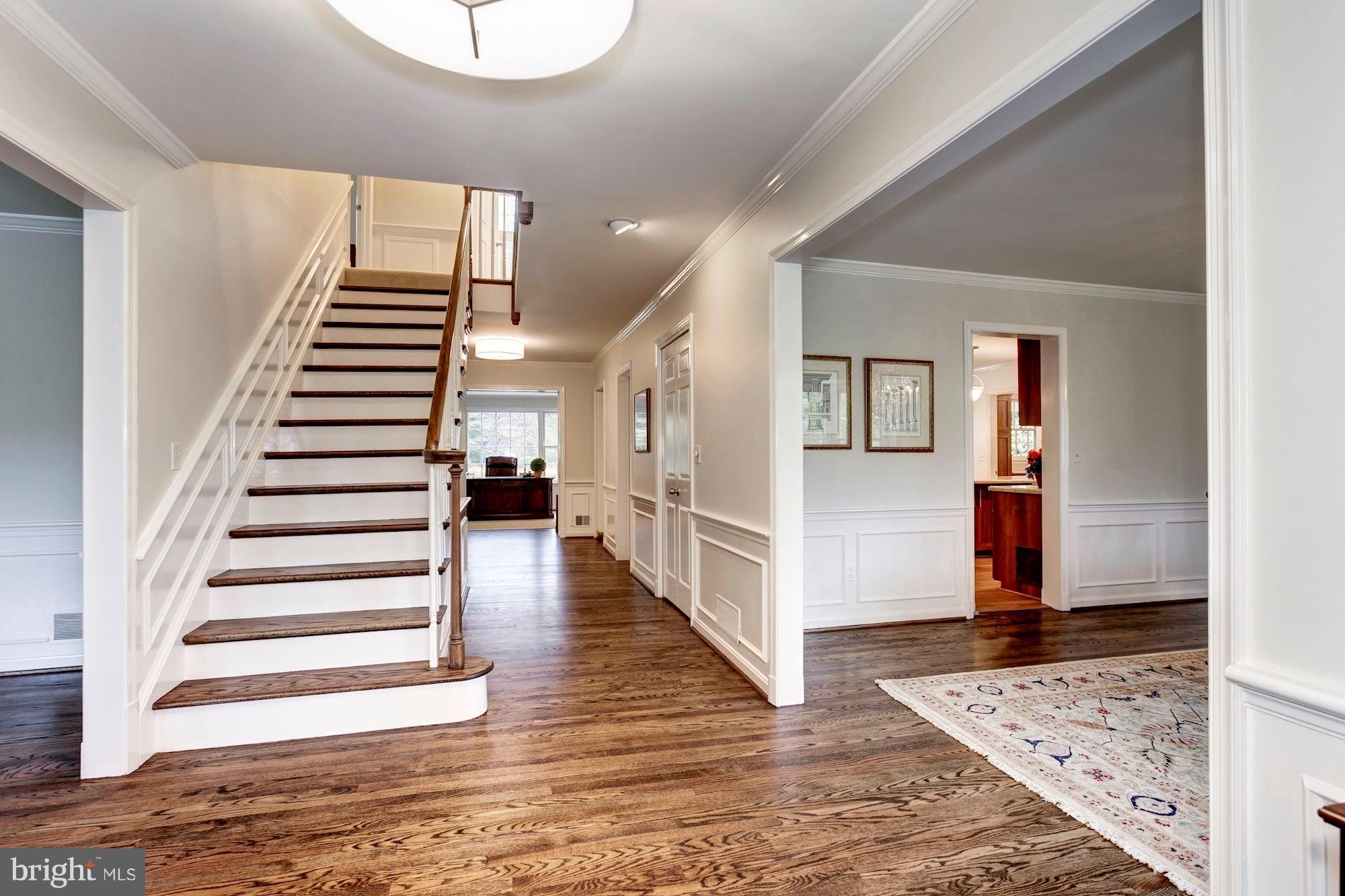 11000 Cripplegate Road Potomac, MD 20854 - Photo 3 of 44 a view of entryway and hall with wooden floor