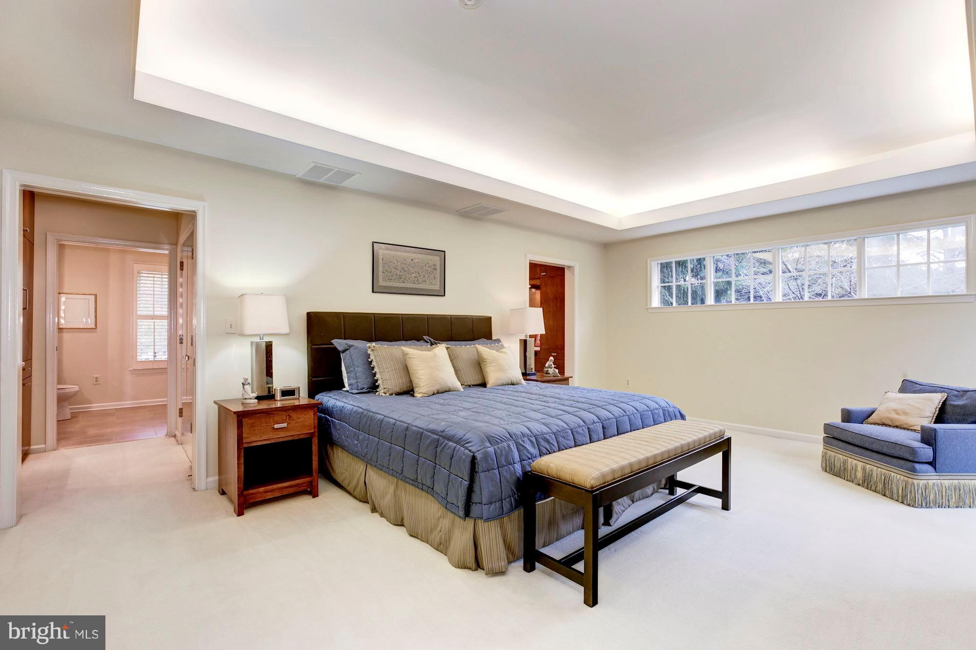 11000 Cripplegate Road Potomac, MD 20854 - Photo 21 of 44 a spacious bedroom with a bed and window