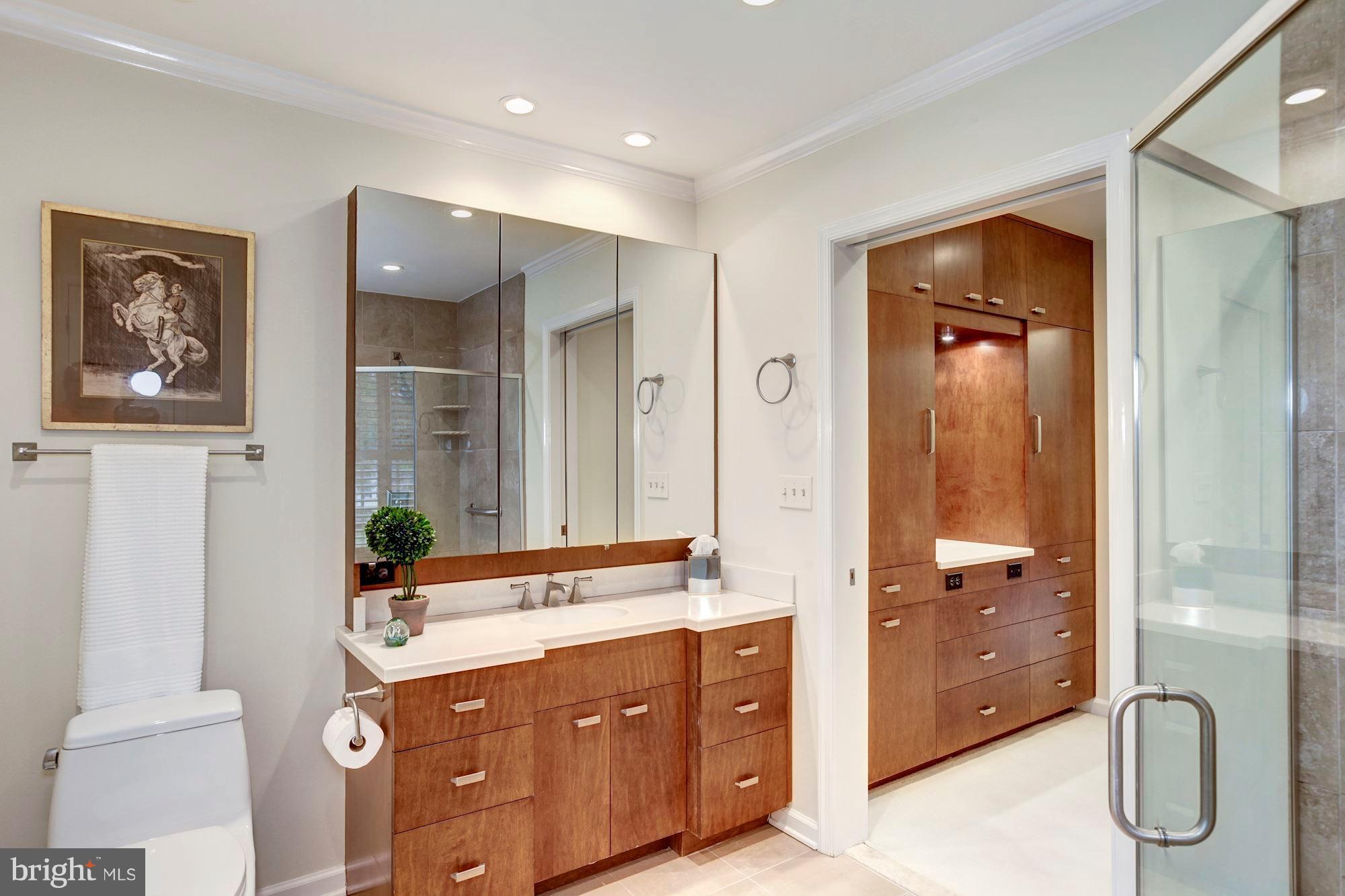 11000 Cripplegate Road Potomac, MD 20854 - Photo 23 of 44 a spacious bathroom with a double vanity sink and a mirror