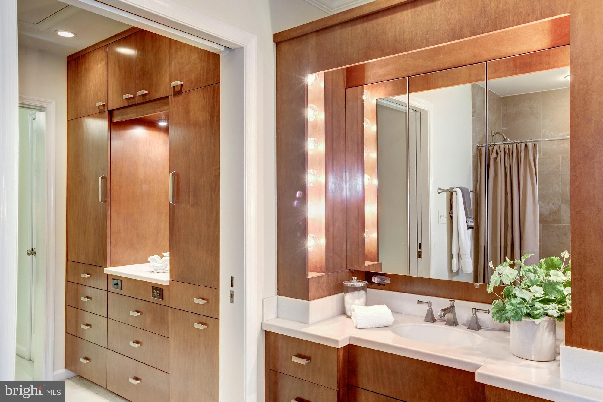 11000 Cripplegate Road Potomac, MD 20854 - Photo 24 of 44 a bathroom with a double vanity sink and a mirror