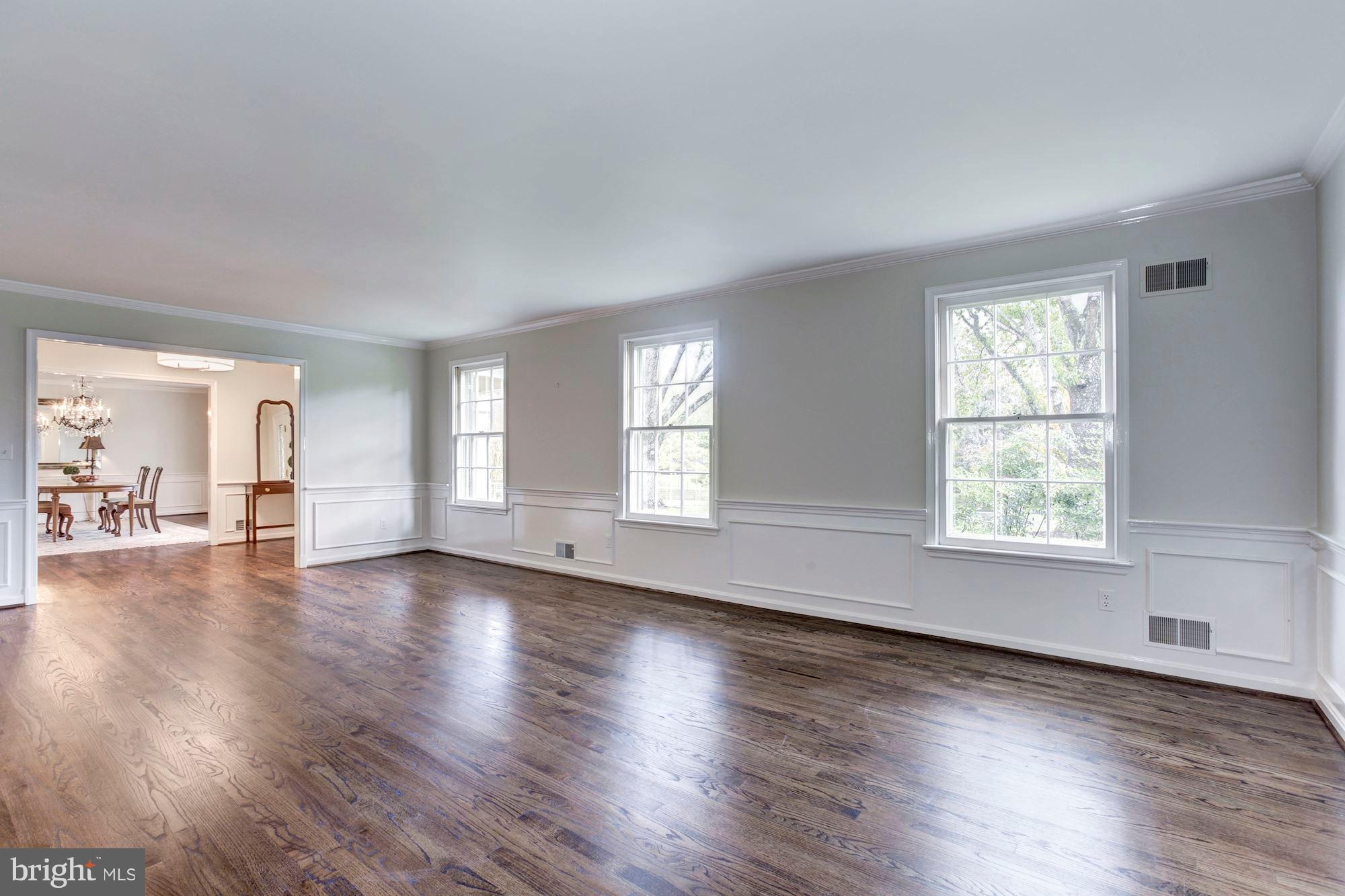 11000 Cripplegate Road Potomac, MD 20854 - Photo 4 of 44 an empty room with wooden floor and windows