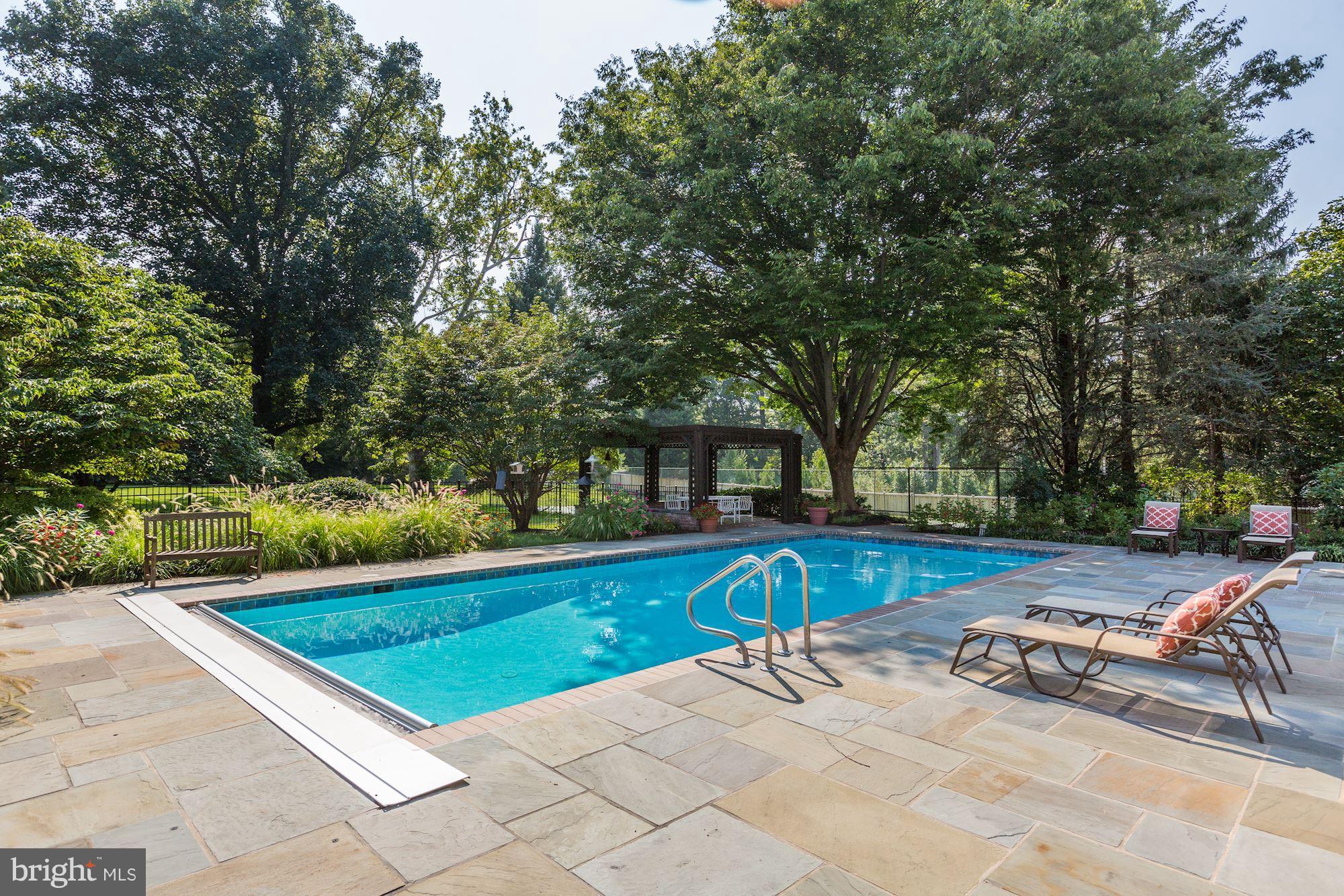 11000 Cripplegate Road Potomac, MD 20854 - Photo 38 of 44 a view of a swimming pool with a patio