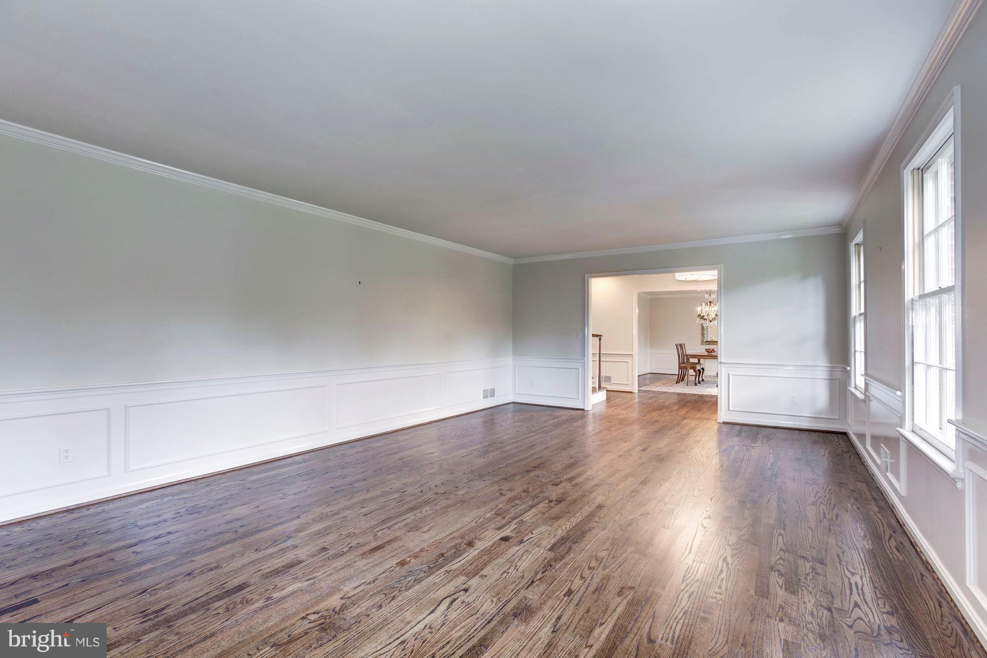 11000 Cripplegate Road Potomac, MD 20854 - Photo 5 of 44 a view of empty room with wooden floor and fireplace