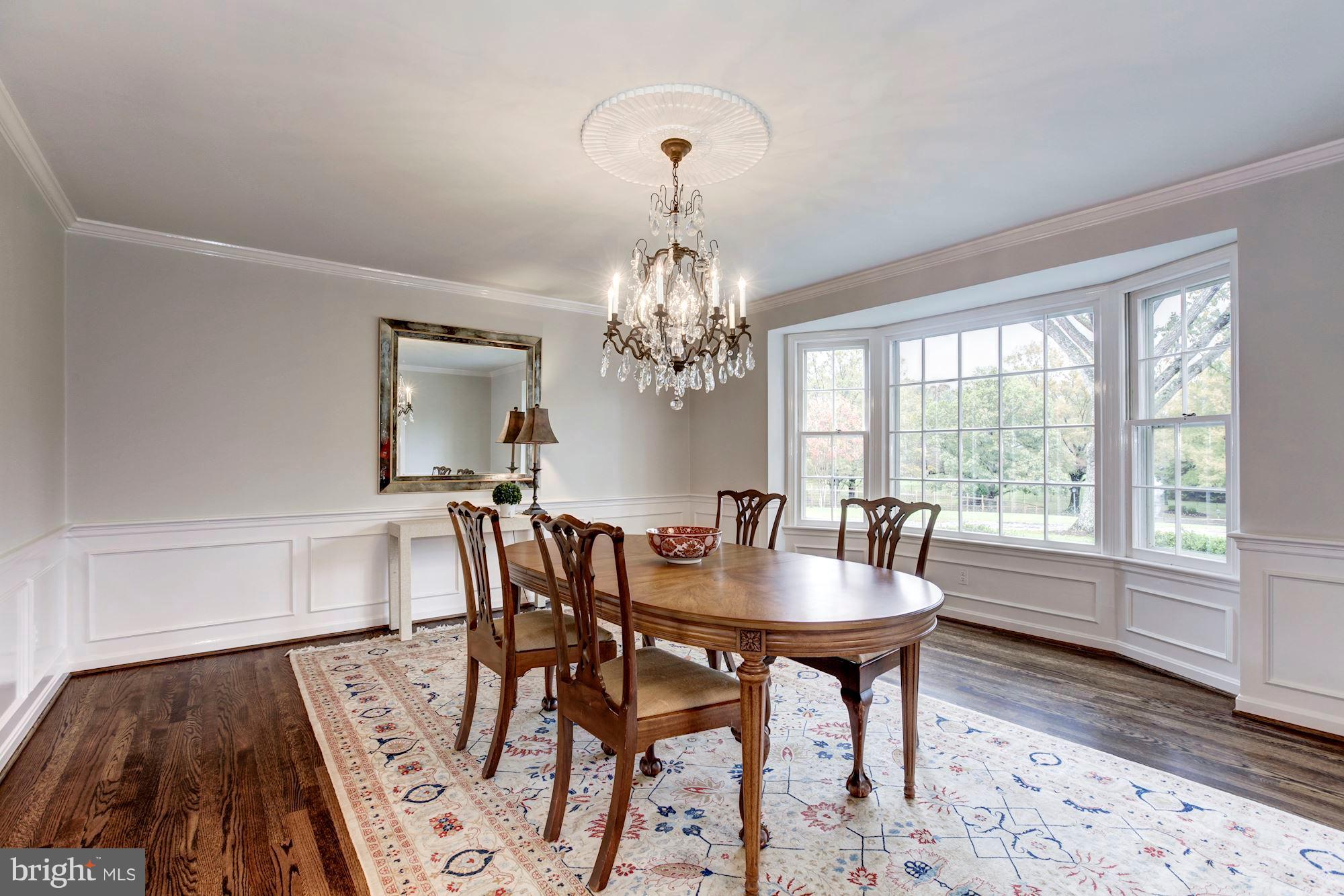 11000 Cripplegate Road Potomac, MD 20854 - Photo 6 of 44 a view of a dining room with furniture window and wooden floor
