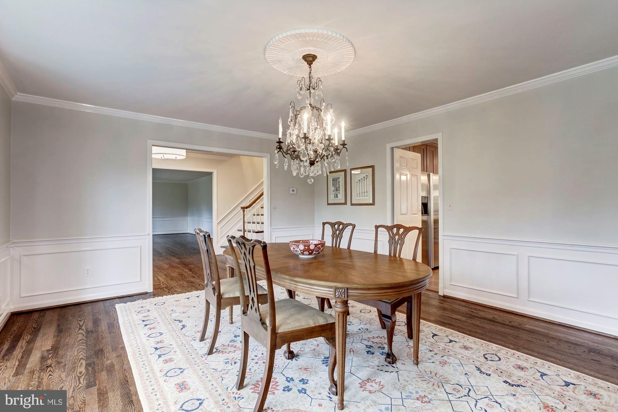 11000 Cripplegate Road Potomac, MD 20854 - Photo 7 of 44 a dining room with furniture and chandelier
