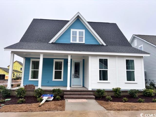 View of front of house with covered porch