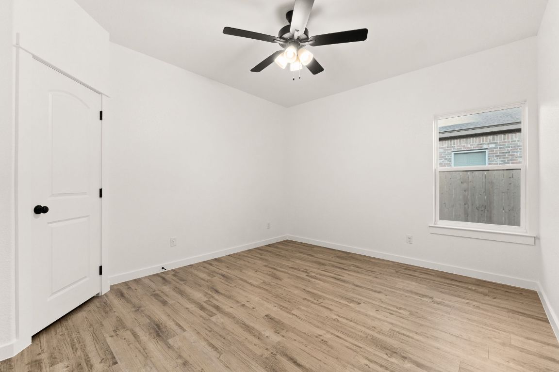 3602 Canvasback Road Killeen, TX 76542 - Photo 13 of 29 a view of empty room with wooden floor and fan