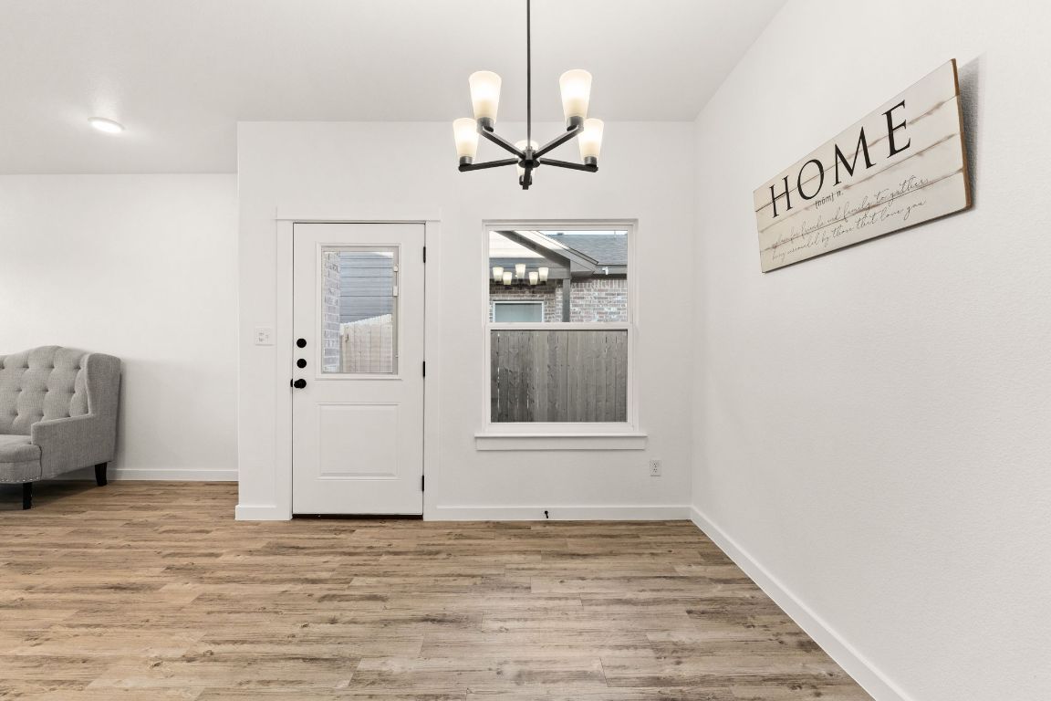 3602 Canvasback Road Killeen, TX 76542 - Photo 8 of 29 a view of an empty room with window and wooden floor
