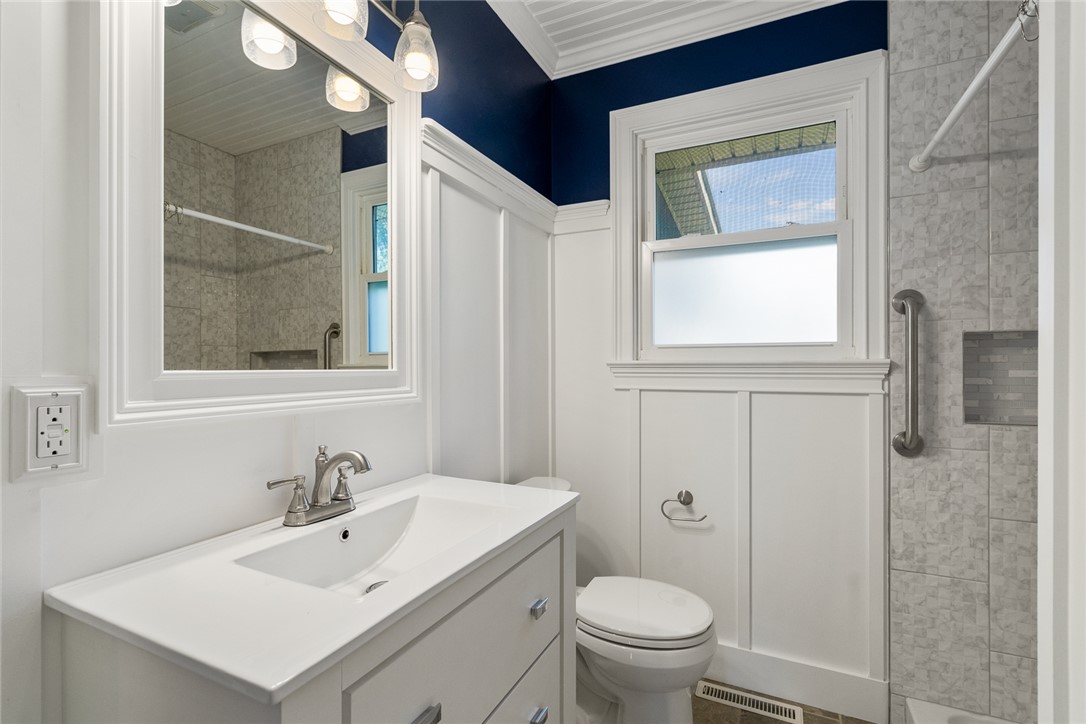 1509 869 Anderson, SC 29621 - Photo 28 of 45 A well-appointed bathroom features a modern vanity, framed mirror, and a tiled shower for comfort and style.
