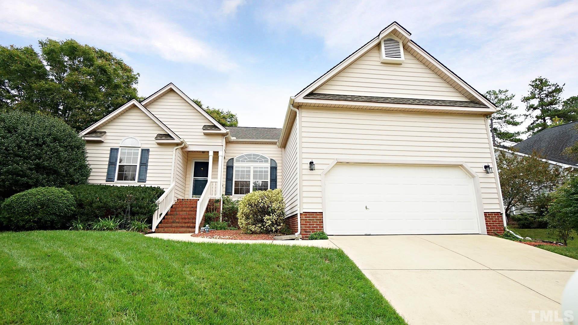 8316 Trumpetor Way Raleigh, NC 27613 - Photo 2 of 26 a front view of a house with garden