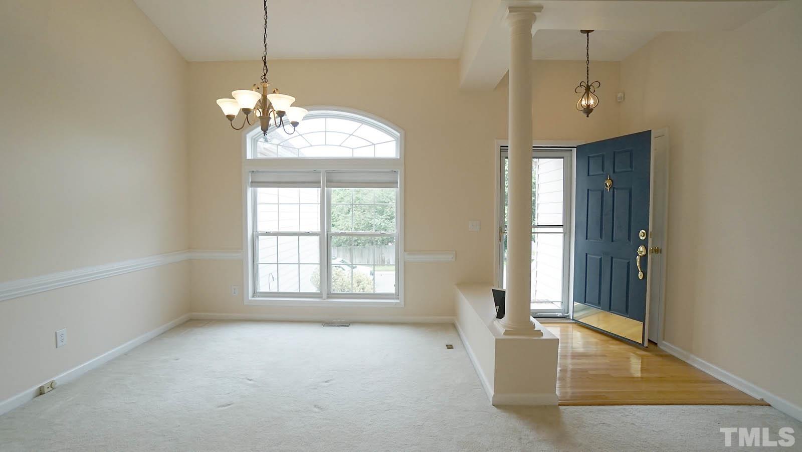 8316 Trumpetor Way Raleigh, NC 27613 - Photo 3 of 26 a view of an empty room with a window