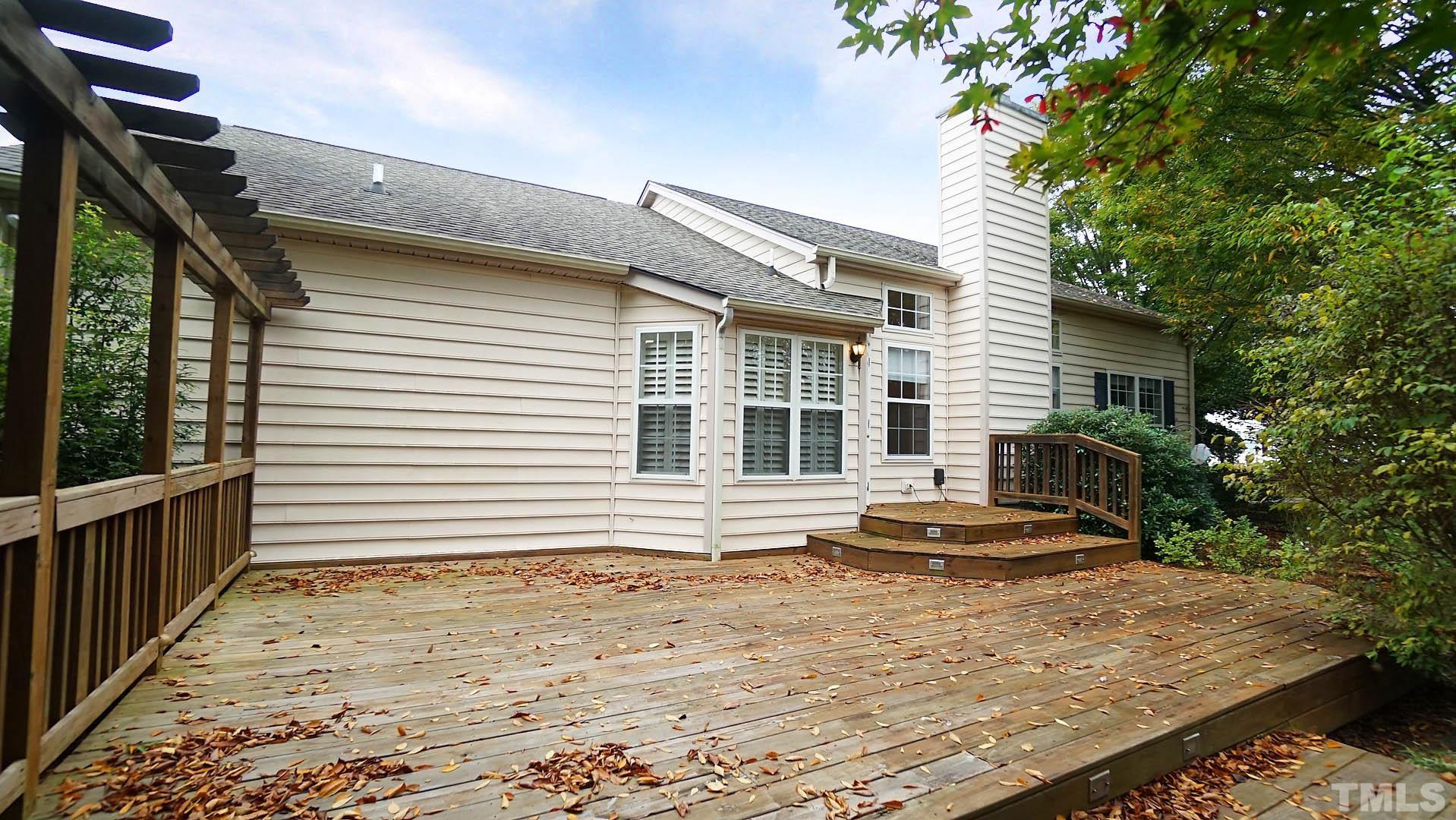 8316 Trumpetor Way Raleigh, NC 27613 - Photo 22 of 26 a front view of a house with a yard