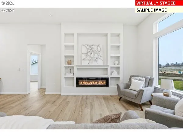 a view of an empty room and wooden floor
