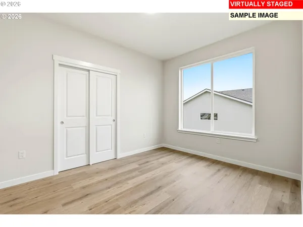a bathroom with a granite countertop sink a toilet a mirror and shower