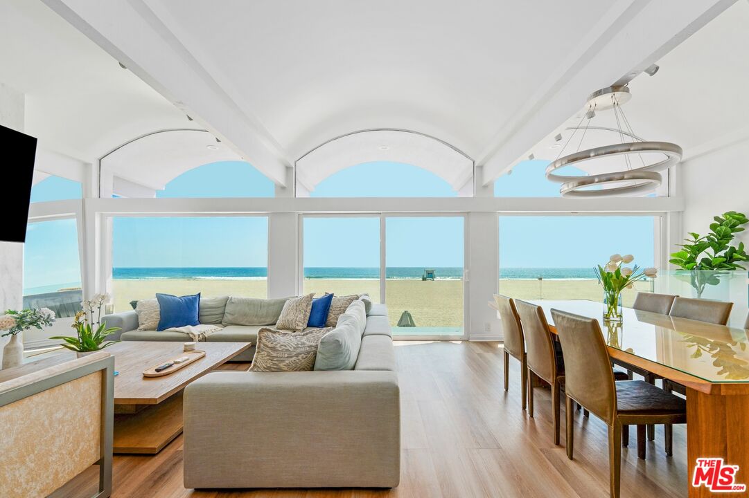 3806 Ocean Front Walk Marina del Rey, CA 90292 - Photo 3 of 40 a living room with furniture and two large window