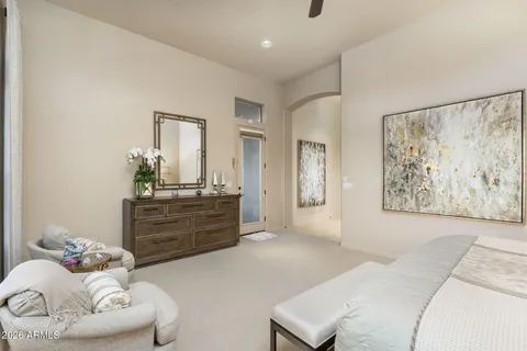 a large spacious bathroom with a large tub sink and mirror