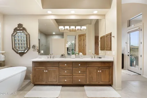 a bathroom with a sink mirror vanity and toilet