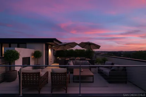 a outdoor living space with furniture and a potted plant