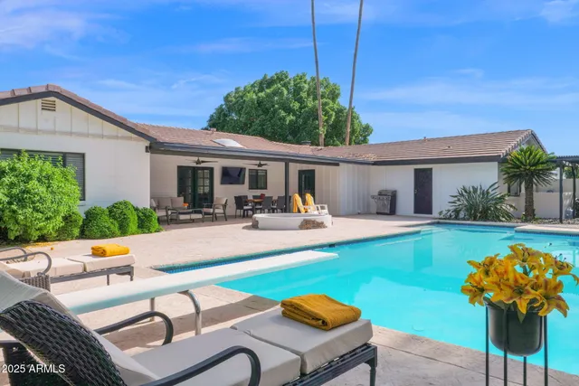 a view of a patio with swimming pool table and chairs