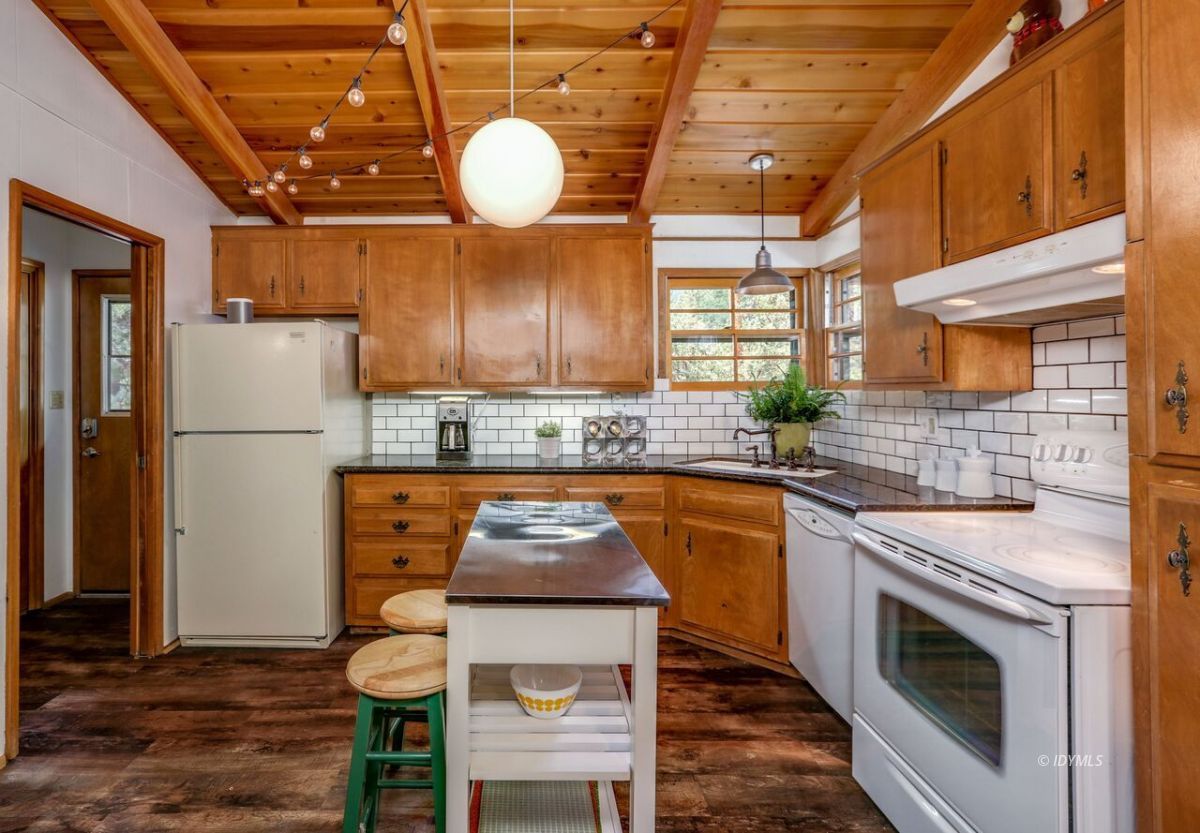 25405 Seneca Road Idyllwild, CA 92549 - Photo 15 of 61 a kitchen with stainless steel appliances granite countertop a sink a stove and a refrigerator