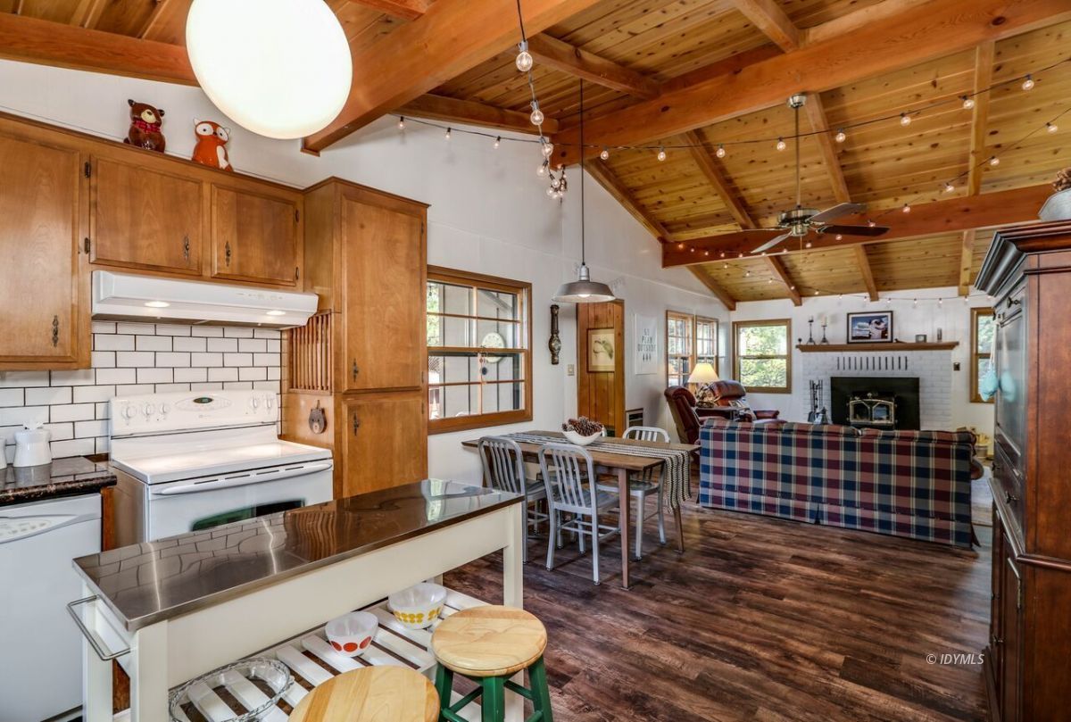 25405 Seneca Road Idyllwild, CA 92549 - Photo 19 of 61 a view of a dining room with furniture window and wooden floor