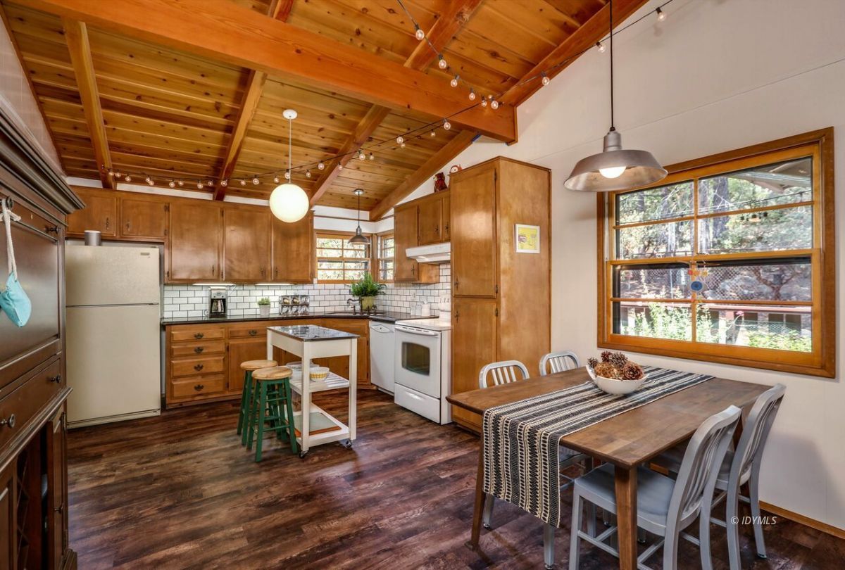 25405 Seneca Road Idyllwild, CA 92549 - Photo 20 of 61 a view of a dining room with furniture window and wooden floor