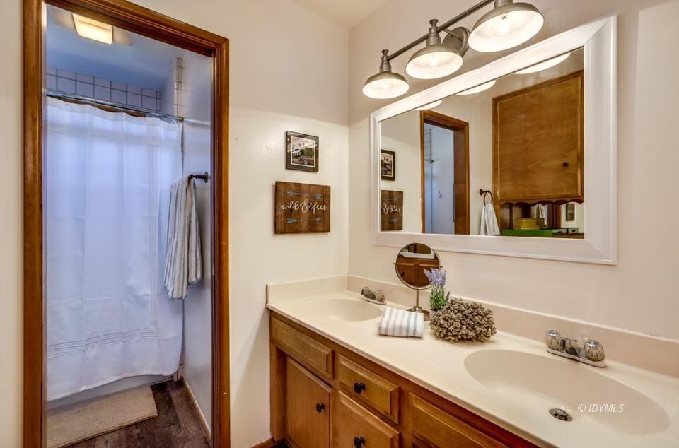 25405 Seneca Road Idyllwild, CA 92549 - Photo 30 of 61 a bathroom with a sink vanity granite and a mirror