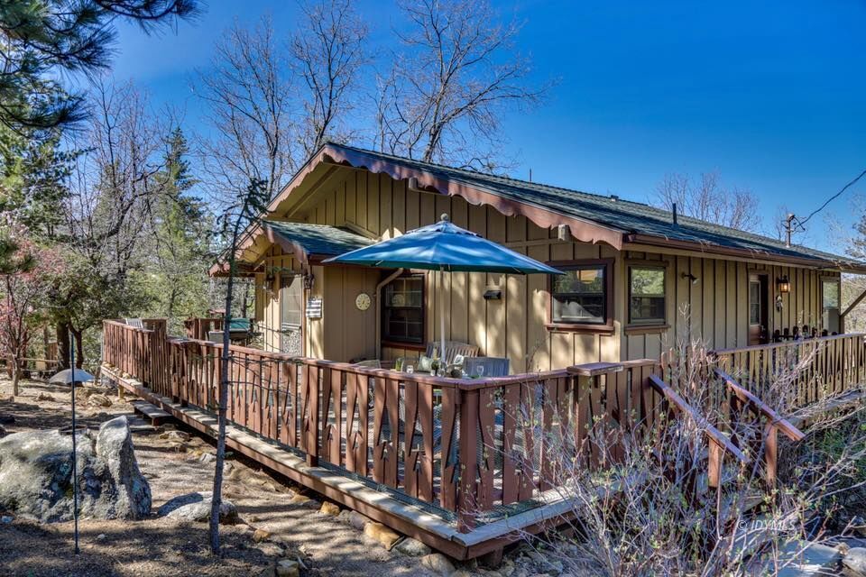 25405 Seneca Road Idyllwild, CA 92549 - Photo 3 of 61 a view of small house with wooden fence