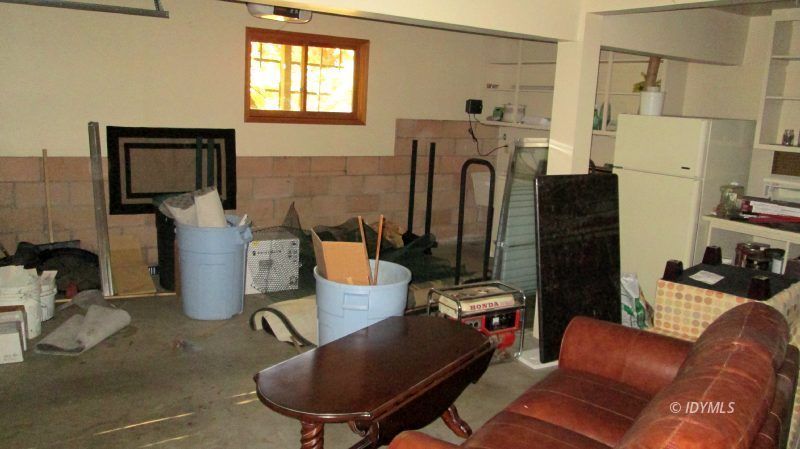25405 Seneca Road Idyllwild, CA 92549 - Photo 60 of 61 a living room with furniture a mirror and a fireplace