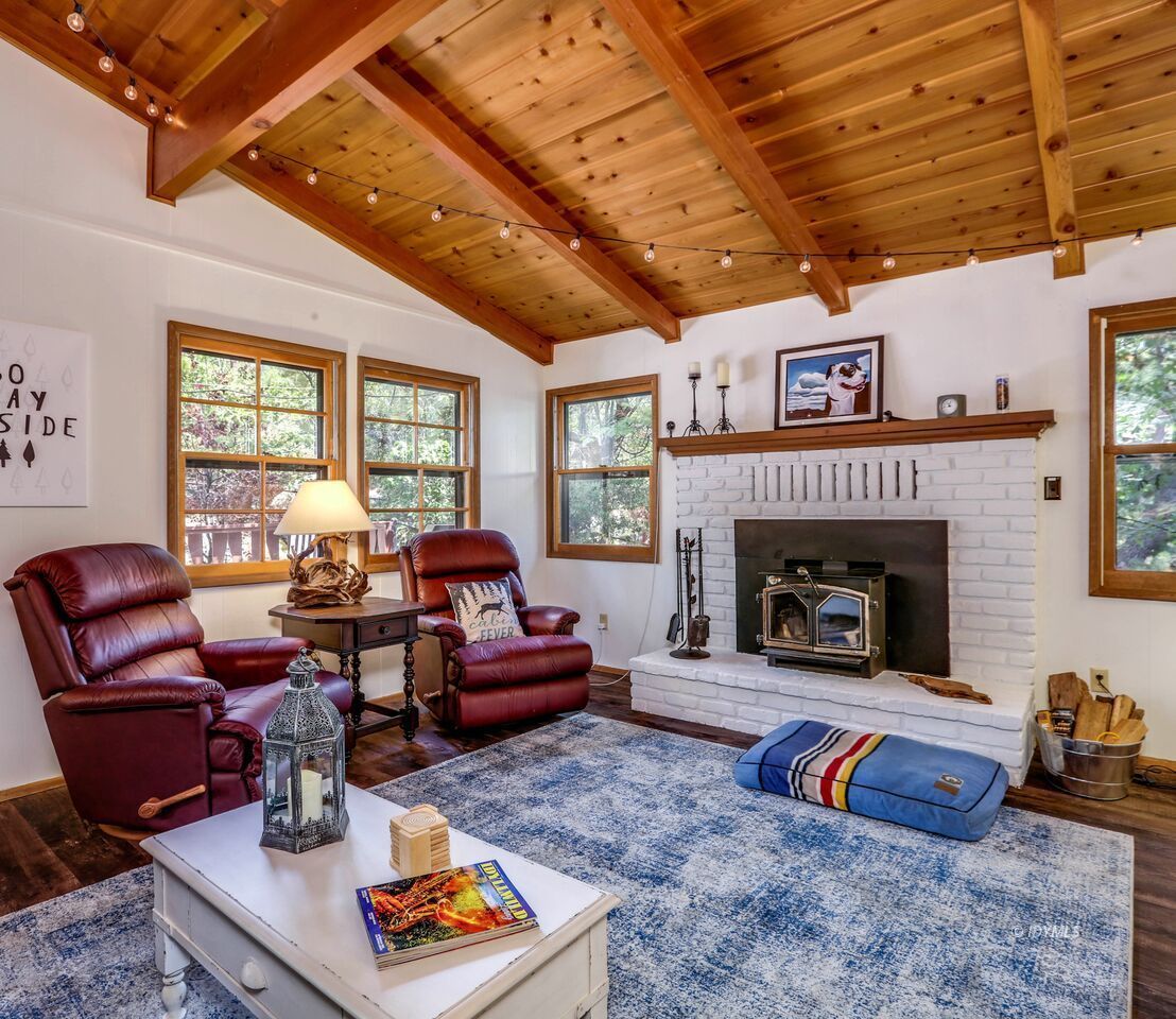 25405 Seneca Road Idyllwild, CA 92549 - Photo 10 of 61 a living room with furniture and a fireplace